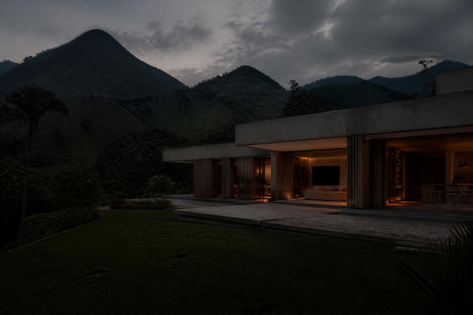 Casa contemporánea de concreto y madera al atardecer en el paisaje del Quindío